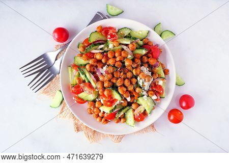 Healthy Mediterranean Salad With Chick Peas. Above View With Frame Of Ingredients Over A White Marbl