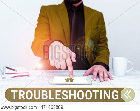 Text Sign Showing Troubleshooting. Business Concept An Act Of Investigating Or Dealing With In The P