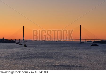 Suspended Cable-stayed Bridge From The Mainland Of The Far Eastern City To The Russian Island. The S
