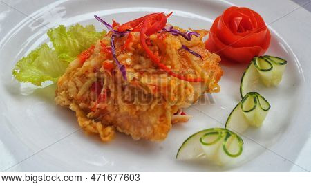 Fried Chicken With Extra Spicy Traditional Chili Sauce Or Ayam Geprek