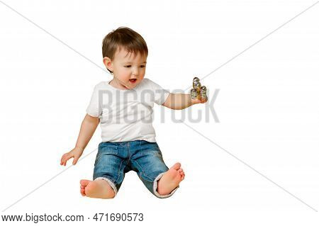 Toddler Baby Plays With A Musical Rattle Bells On A Stick, Studio Isolated On A White Background. Ha