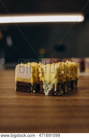 Beautiful Young Chef Decorating Delicious Dessert On Modern Kittchen