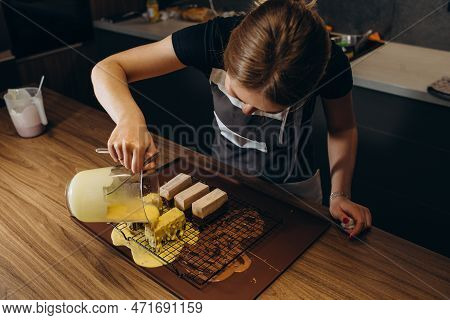 Beautiful Young Chef Decorating Delicious Dessert