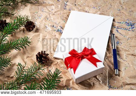 Several White Sheets Of Stationery For Writing On A New Years Background And A Gift Box With A Beaut