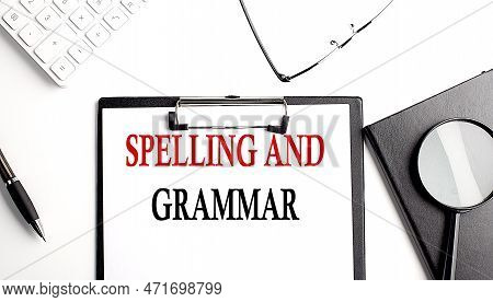 Spelling And Grammar Text On White Paper. The Inscription On Notebook