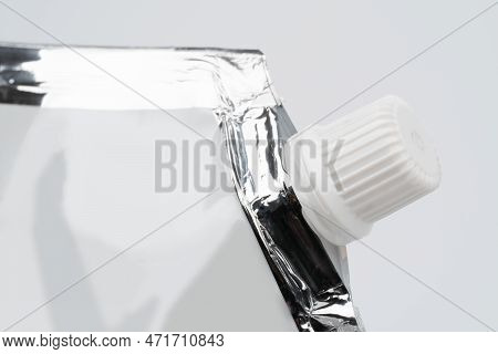Blank Spout Pouch With Cap Or Doy Pack. Front View Of Blank Glossy White Doypack With Cap Or Stand-u