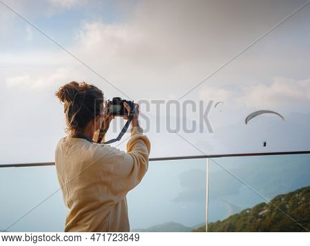 Woman Enjoys The View From The Viewpont Over Oludeniz, Turkey. Sunset, Clouds, Paragliders. Mount Ba