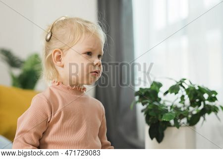 Cochlear Implant System. Installation Cochlear Implant On Child Girl Ear For Restores Hearing. Kid H