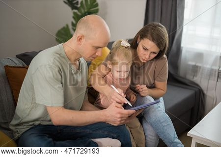 Cochlear Implant System. Installation Cochlear Implant On Child Girl Ear For Restores Hearing. Kid H