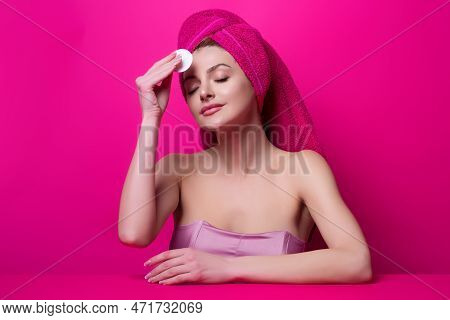 Woman Cleaning Face With A Cotton Pad. Skincare, Cotton Pad And Woman Cleaning Face On Studio Backgr