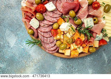 Appetizers Table. Cheese, Fuits And Meat Board On A Blue Background. Banner, Menu, Recipe Place For 