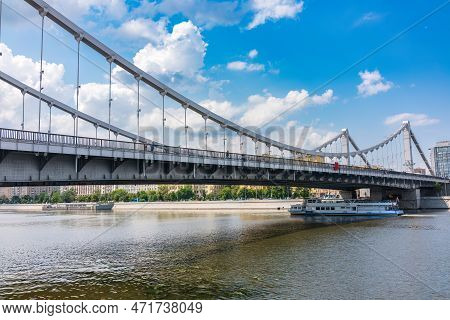 Krymsky Bridge Or Crimean Bridge In Moscow And Cruise Ship Sails On The Moscow River. Steel Suspensi