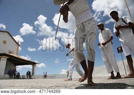 Salvador, Bahia, Brazil - January 1, 2023: Members Of Candombles Make Offerings On The Beach In Umai