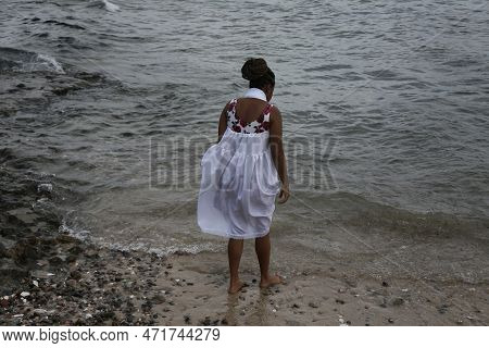 Salvador, Bahia, Brazil - January 1, 2023: Members Of Candombles Make Offerings On The Beach In Umai