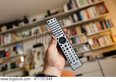 Frankfurt, Germany - Feb 23, 2023: Pov Male Hand Holding New Onkyo Rc-816c Remonte Control With Usb 