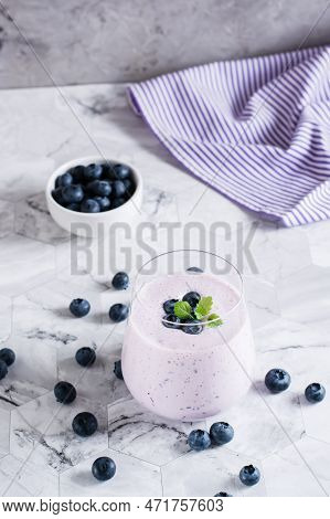 A Glass Of Blueberry Smoothie On The Table. Antioxidant Organic Healthy Food. Vertical View
