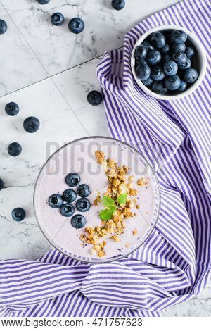 Smoothies With Blueberries And Granola In A Bowl. Organic Antioxidant Healthy Food. Top And Vertical