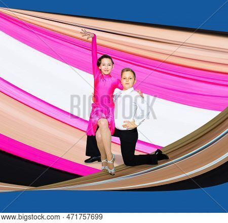 The Young Boy And Girl Posing At Dance Studio On Abstract Art Design. The Ballroom Dancing Concept