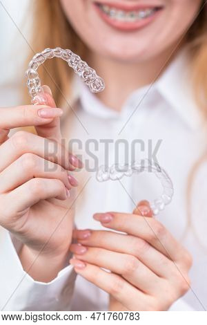 Girl With A Beautiful Smile Holding A Transparent Mouth Guard