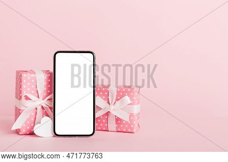 Mobile Phone With Blank Screen On Colored Background With Hearts, Calendar And Gift Box, Valentine D