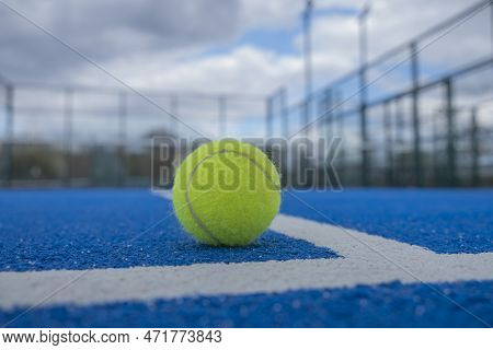 Ground Level View Of A Ball In A Blue Paddle Tennis Court, Racket Sports Courts