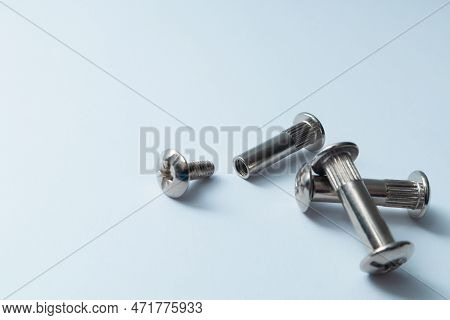 Furniture Ties Or Screws. Coupling Bolt On A White Background. Furniture Assembly Hardware Options