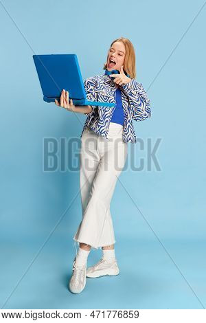 Full-length Portrait Of Beautiful Positive Girl Having Online Video Call On Laptop, Talking Over Blu