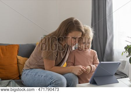 Deaf Child Girl With Cochlear Implant Studying To Hear Sounds And Have Fun With Mother - Recovery Af