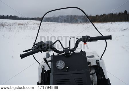 Concept Of Outdoor Activities And Sports In Cold Winter. Snowmobile Without Person Standing In Winte