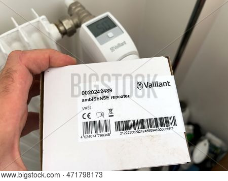 London, United Kingdom - Jan 1, 2022: Pov Male Hand Holding Vaillant Ambisense Repeater For The Gas 