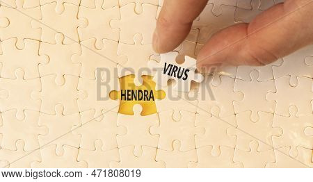 Hendra Virus Symbol. Concept Words Hendra Virus On White Paper Puzzles. Beautiful Yellow Table Yello