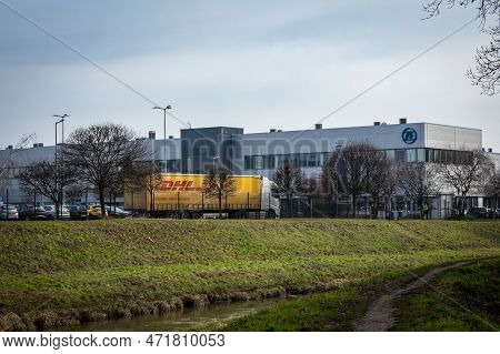 Wroclaw, Poland - February 26, 2023: Zf Company Building With A Dhl Delivery Truck Parked In Front.