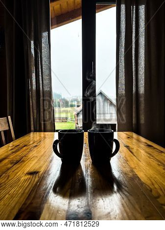 Two Cups Of Tea On The Table In The Morning