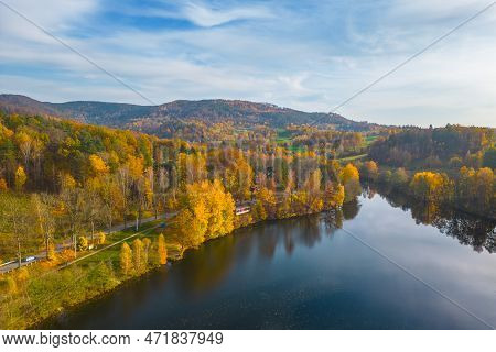 Fojtka Water Reservoir Surrounded By Vibrant Colored Forest At Autumn Time. Aerial View From Drone.