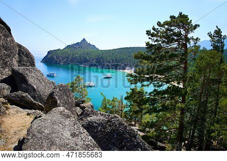 Picturesque Seascape. Yachts In A Bay With Turquoise Water Color. Around The Rocks, Huge Stones And 