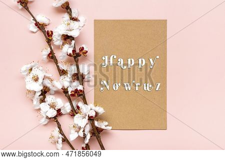 Sprigs Of The Apricot Tree With Flowers On Pink Background Text Happy Nowruz Holiday Concept Of Spri