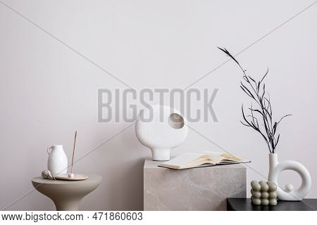 Aesthetic Interior Of Living Room With White Wall, Marble Stand, Round Coffee Table, Vase With Dried