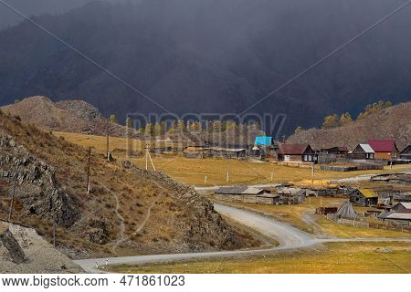 Russia. The South Of Western Siberia, The Altai Mountains. The Village Of Tenga, Illuminated By The 