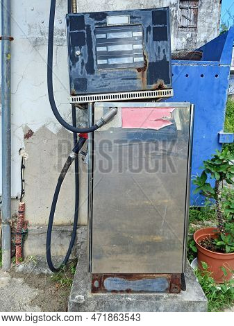 Close Up Of Abandoned Airbox. Old Gas Station Tire Inflator In The French West Indies. Service Stati