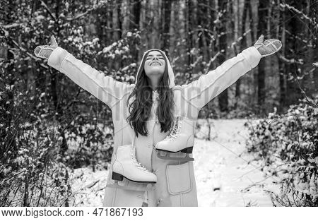 People In Snow. Beauty Winter Girl In Frosty Winter Park. Outdoor Close Up Portrait Of Young Beautif