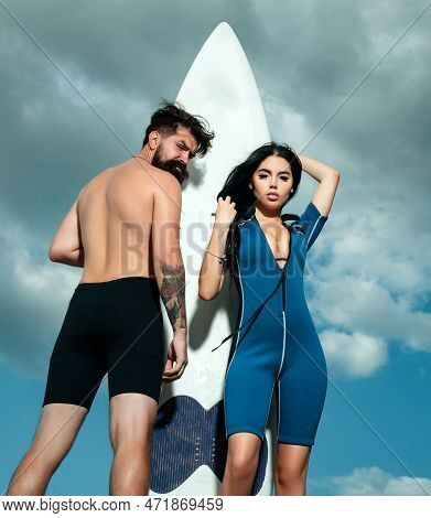 Couple Summer Vacation. Sexy Woman In Bikini. Summertime Concept. Sexy Man In Swimsuit. Surfboard.
