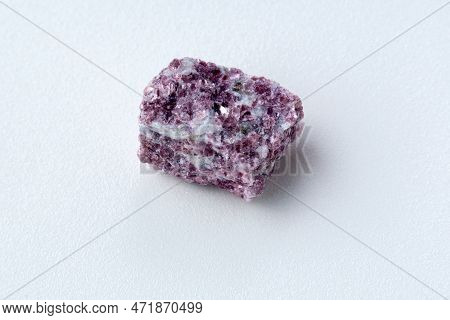 Lepidolite Stone On A White Background, Being A Secondary Source Of Lithium, Used In Batteries