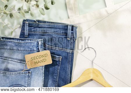 Sustainable Still Life With Djinns With Label Second Hand, Textile Bag And Hanger. Second Hand Cloth