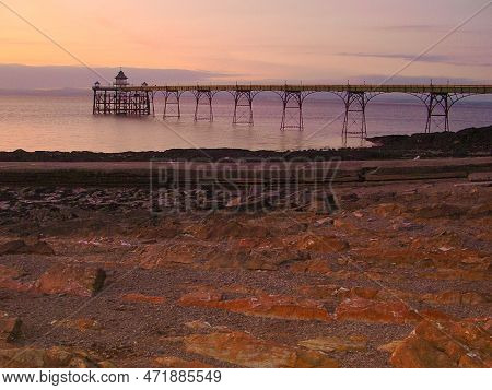 View Of Battery Point Lighthouse Over The Sea At Sunset. Rocky Coast On The Bristol Channel. Portish