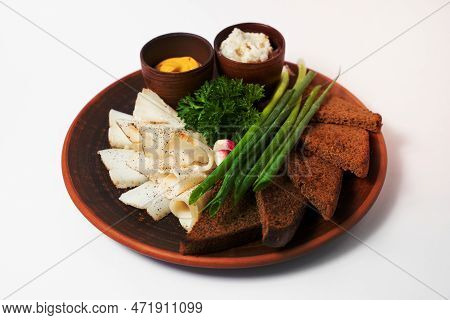 A Delicious Dish Of Sliced Lard With Bread And Spices