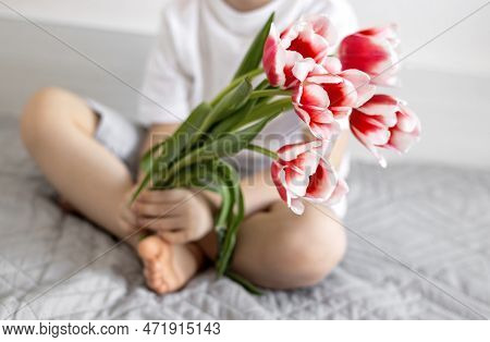Tulips On Jeans And Spring Calling On Smartphone Kid Holding Flower
