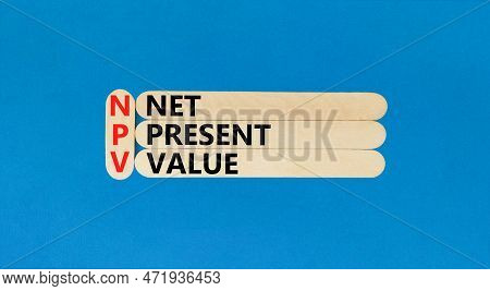 Npv Net Present Value Symbol. Concept Words Npv Net Present Value On Wooden Stick On A Beautiful Blu