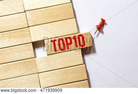 Top 10 Sign Made Of Wooden Dices On A Table I A Bright Environment With Blue Colors
