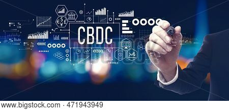 Cbdc - Central Bank Digital Currency Concept With Businessman In A City At Night