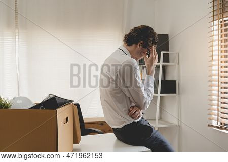 Unemployed, Quite Job. Desperate Caucasian Young Businessman Resigning From Company, Packing Belongi